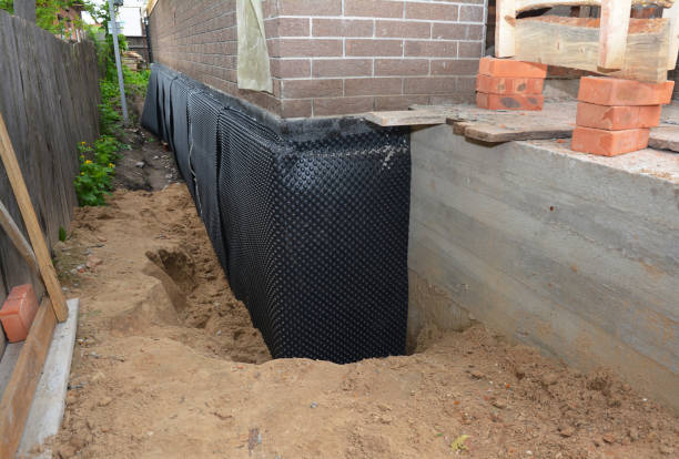 Happy homeowners after waterproofing job in Glenmont